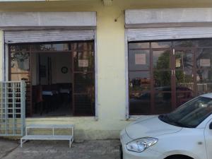a white car parked in front of a building at Hotel madhav regency bhopal in Misrod