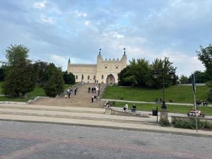 a building with people walking in front of it at Apartament Ana in Lublin