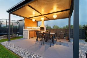 a patio with a table and chairs under a pavilion at Villa Tea by Rent Istria in Umag