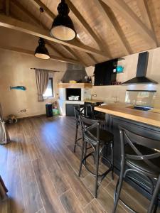 a kitchen with a bar and chairs in a room at Villa Jalan in Vrsi +93 photos
