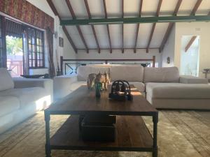 a living room with a couch and a coffee table at Executive Serviced Home in Johannesburg