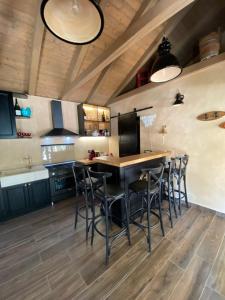 a kitchen with a table and chairs in a room at Villa Jalan in Vrsi