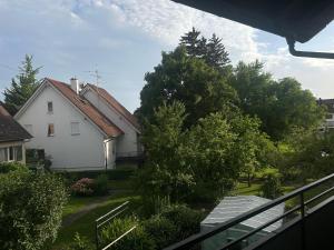 a view of a house from a balcony at Pension Zimmermann in Unteruhldingen