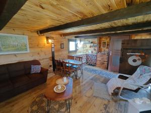 a living room with a couch and a table at Słoneczne Łąki in Wólka Soseńska +38 photos
