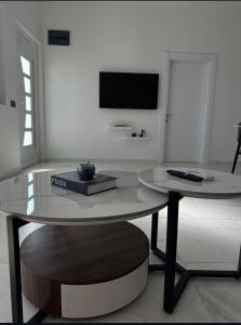 a table with a book on it in a living room at Martin Apartments in Gornji Štoj