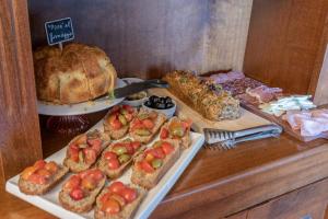 a table with a turkey and other food on it at Hotel Oviv - La dimora del Borgo in Acquaviva Picena
