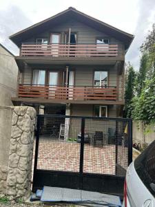 a house with a fence in front of it at Guesthouse Sunshine Ureki in Ureki +17 photos