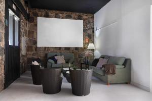 a living room with two couches and a blank canvas at Brothers House in Arrecife