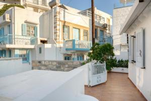 a view from the balcony of a house with white buildings at Consolato House in Patmos