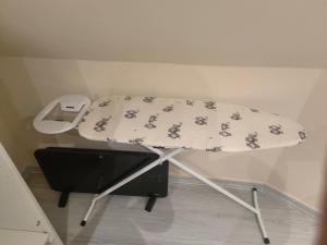 a table with a dog pattern on it in a room at Yunus in Croydon