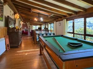 a pool table in the middle of a room at Casa Rural Istikot in Errazu