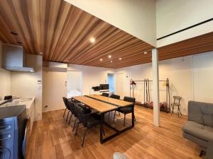 a kitchen and dining room with a table and chairs at テラスKawazu in Kawazu