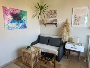 a living room with a couch and a table at Studio Seaven, Lozenets in Lozenets