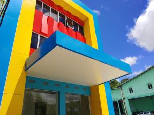 a large building with a colorful facade at Priority Teuku Umar Samarinda in Loa Bakong