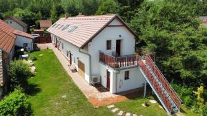 an aerial view of a white house with a metal roof at Apartmán Ateliér in Bílé Vchynice