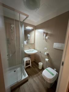 a bathroom with a toilet and a sink and a shower at Domus Ciliota in Venice +49 photos