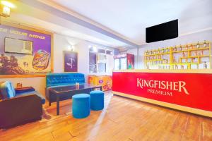 a restaurant with a kingsferdin sign on the wall at Hotel Shaan- M I Road City Centre in Jaipur