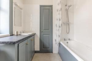 a bathroom with a sink and a tub and a shower at 3 Bed in Northrepps oc-k29801 in Cromer +14 photos