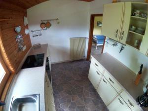 a kitchen with a sink and a counter top at Blockhaus Hipp in Steingaden