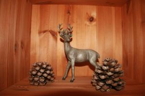 a figurine of a deer and two pine cones at Blockhaus Hipp in Steingaden