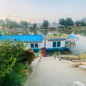 a large boat is docked on a river at Blackpearl in Srinagar +1 photo