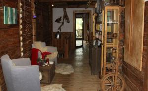 a living room with wooden walls and wooden floors at Schauinstal Appartement 2 in Lutago +9 photos
