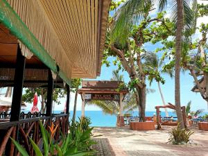 a resort with the ocean in the background at Mira Mare Resort Koh Samui in Lamai +101 photos