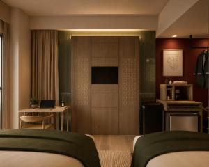 a hotel room with a kitchen and a living room at Lokai Boutique Hotel in Dumaguete