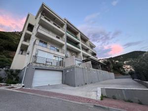 a large apartment building with a garage at Przno in Pržno