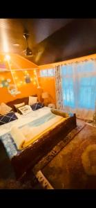 a bedroom with a large bed in a room at Blackpearl in Srinagar