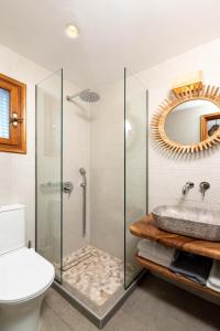 a bathroom with a shower and a sink at Adilon in Tsagarada
