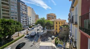 a view of a city street with cars and buildings at Heritage apartamentos in Villajoyosa