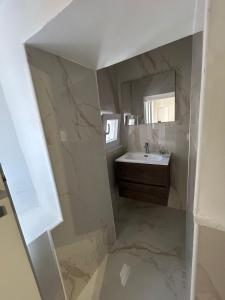 a bathroom with a sink and a mirror at Domus Tarquinia in Tarquinia +4 photos