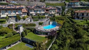 an aerial view of a house with a swimming pool at IseoLakeRental - Collina Divina in Solto Collina