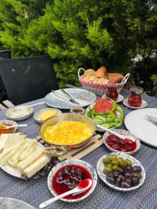 a table topped with plates of food and vegetables at Tepehan by Özkul in İzmir