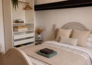 a bedroom with a bed with a book shelf at Gîte Chez Hanna et Michel 2 chambres in Morsbronn-les-Bains