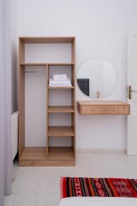 a dressing room with a mirror and a shelf at VILLA Lafayette in Tunis