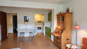 a kitchen with a table and chairs in a room at Stavanger Urban Folkehøyskole in Stavanger