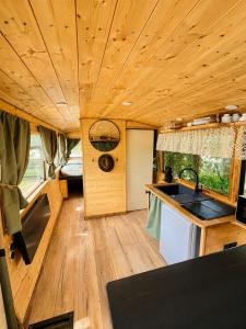 a kitchen and living room in a tiny house at Tiny house - Bus insolite - avec Escape Game in Mignaloux-Beauvoir