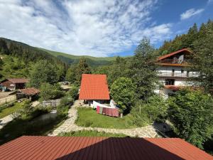 an aerial view of a house with an orange roof at Під Горбком in Bukovets