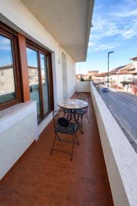a patio with two chairs and a table on a balcony at Suite il Sogno in Francavilla al Mare