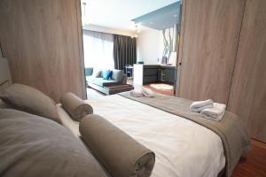 a bedroom with a large bed with towels on it at Benesta Residence by NewInn in Istanbul