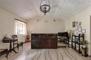 a large living room with a large entertainment center at Resort Coqueiral - A Portuguese Heritage Stay by the Sea in Candolim