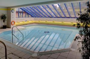 a large swimming pool in a building at Best Western Plus Angel Hotel in Chippenham