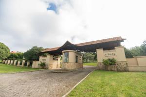a building with a driveway in front of it at Bevuline in Gqeberha