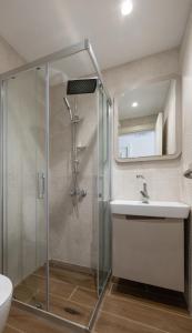 a bathroom with a shower and a sink at The Mint Urla in Kuscular +46 photos