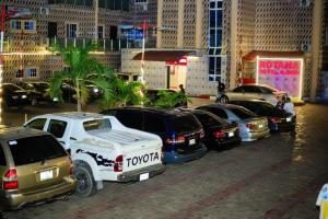 a group of cars parked in a parking lot at Rotana Hotel and Suits in Ilorin