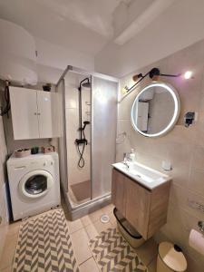 a bathroom with a washing machine and a sink at Mylo Casa Karfas in Chios +16 photos