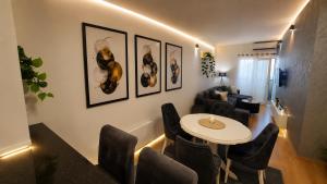 a living room with a table and chairs at Urban Center Paraćin in Paraćin