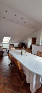 a dining room with a white table and chairs at Roby53 in Parabiago